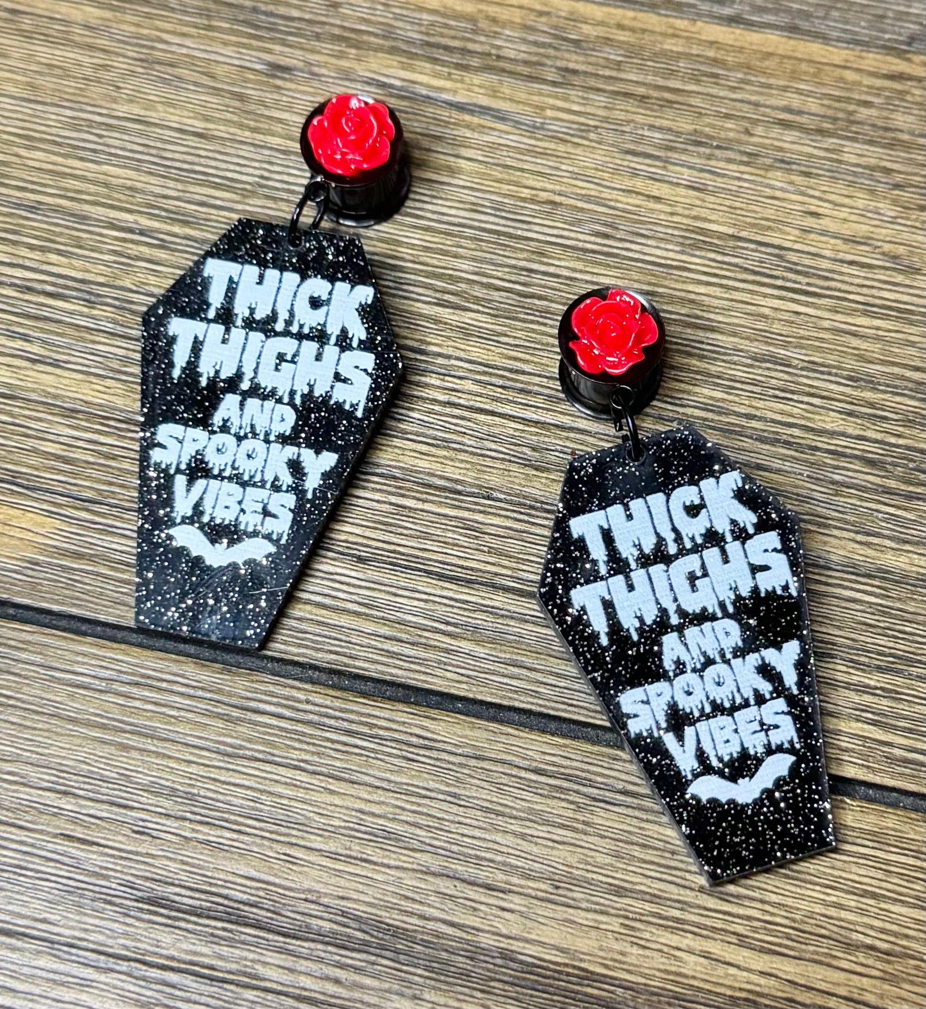 Thick Thighs & Spooky Vibes Glitter Coffin Dangle Ear Tunnels