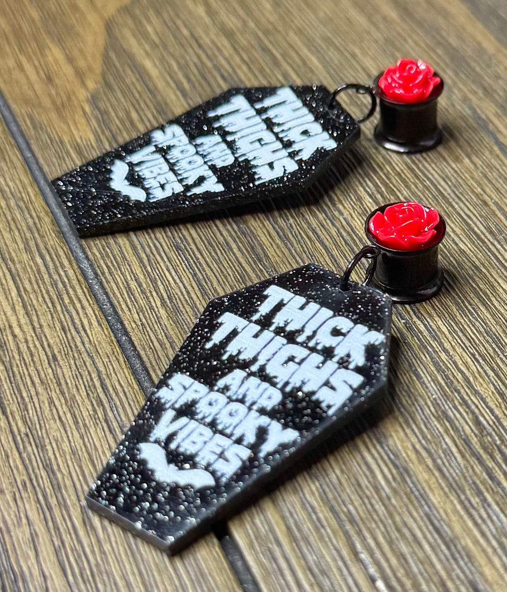 Thick Thighs & Spooky Vibes Glitter Coffin Dangle Ear Tunnels