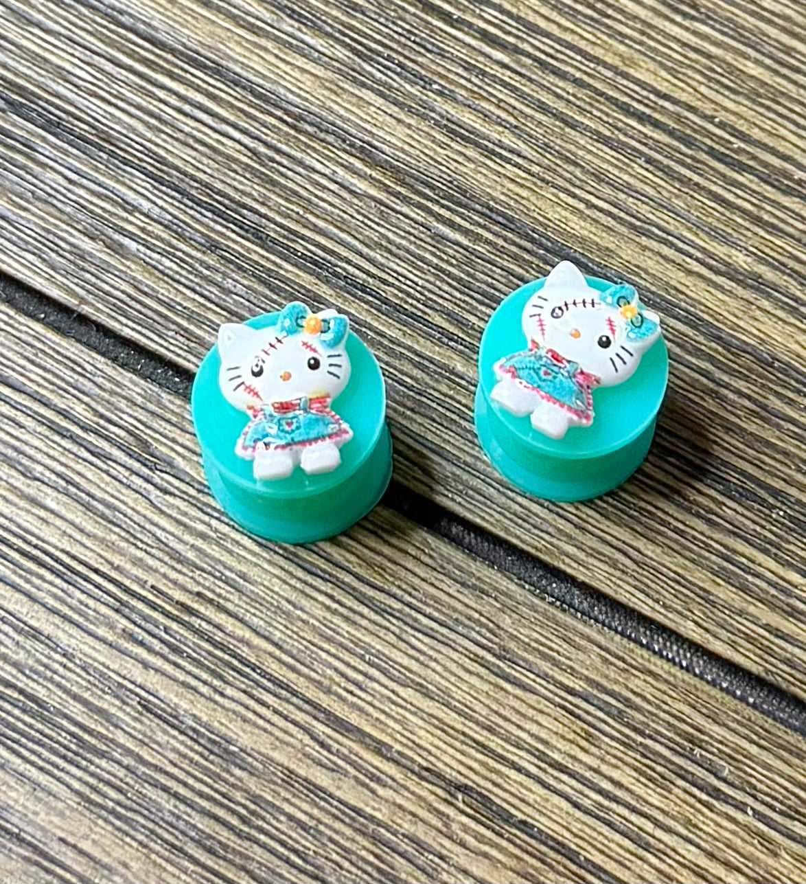 Tiny Hello Kitty Scar Doll Character Ear Plugs